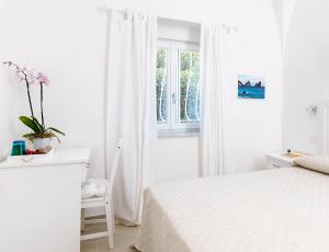 Кровать или кровати в номере Villa Pollio Guest House