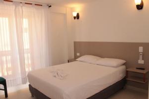 Postel nebo postele na pokoji v ubytování Akel House Hotel