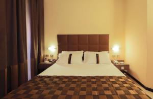 Łóżko lub łóżka w pokoju w obiekcie Best Western Hotel Libertà