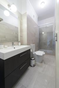 a bathroom with a sink and a shower and a toilet at Beautiful view close to Estádio da Luz in Lisbon