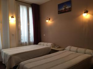 Katil atau katil-katil dalam bilik di Hôtel Paris Gambetta +19 gambar