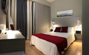 Postel nebo postele na pokoji v ubytování Hotel Valjunco