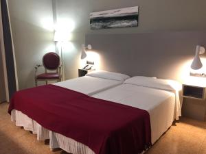 Postel nebo postele na pokoji v ubytování Hotel Valjunco
