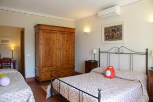 Postel nebo postele na pokoji v ubytování B&B La corte di Stelio
