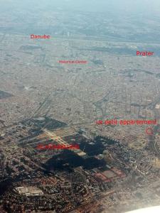 an aerial view of a city from an airplane at Le petit appartement in Vienna