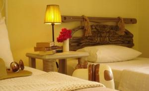 A bed or beds in a room at Han Boutique Hotel