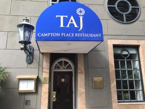 a blue and white sign on the side of a building at Taj Campton Place in San Francisco