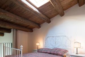 Postel nebo postele na pokoji v ubytování Il Convento sul Gizio