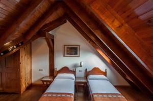 Postel nebo postele na pokoji v ubytování Hotel Vilagaros + 37 fotografií