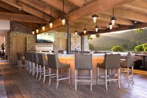 a bar in a restaurant with chairs and a counter at The Ranch at Laguna Beach in Laguna Beach +57 photos