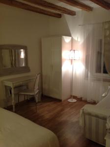 A bed or beds in a room at Il Gelsomino