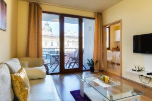 a living room with a view of a building at Trendy Deluxe Apartments in Budapest