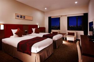 Postel nebo postele na pokoji v ubytování HOTEL MYSTAYS Haneda