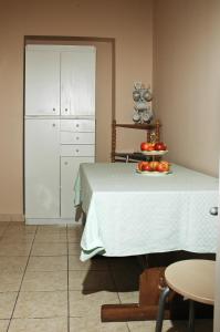 a room with a bed with a table with fruit on it at Amarin Apartments in Hajdúszoboszló +32 photos