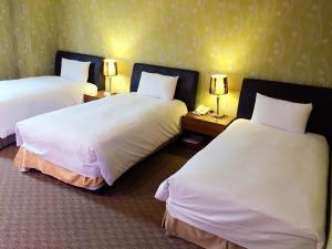 Postel nebo postele na pokoji v ubytování Unic Hotel