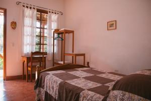 Voodi või voodid majutusasutuse La Casa de Cafe Bed and Breakfast toas