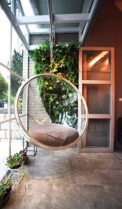 a circular swing hanging from the ceiling of a building at Man Man Bnb in Hualien City +105 photos