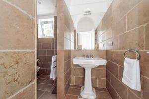 a bathroom with a sink and a mirror at Casa Malu in Positano