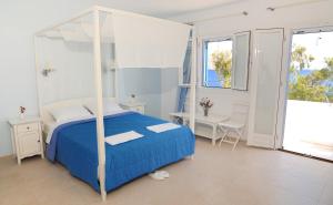 Кровать или кровати в номере Dream Island Hotel