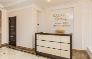a dressing room with a counter and a sign on the wall at Apartment Pearl of Arcadia in Odesa