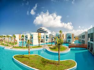 arial view of a resort with palm trees and buildings at Aquasis De Luxe Resort & SPA - Ultra All Inclusive in Didim