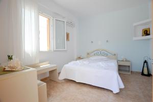 Letto o letti in una camera di Aigaio Studios tinos