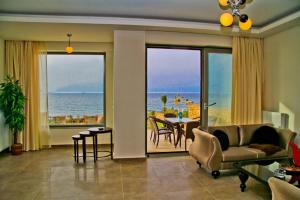 a living room with a view of the ocean at Sea View Beachfront Villa Peri in Gouves