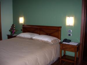 Ένα ή περισσότερα κρεβάτια σε δωμάτιο στο Locanda da Gerry +7 φωτογραφίες