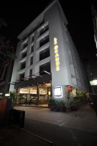 a building with a hotel sign on it at night at Le Grande Residency -Unmarried Couples are not Allowed in Ahmedabad