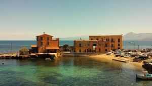 a group of buildings next to a body of water at Casa Lorenzo in Porticello