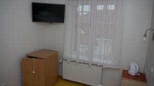 TV a/nebo společenská místnost v ubytování Hommiku Guesthouse
