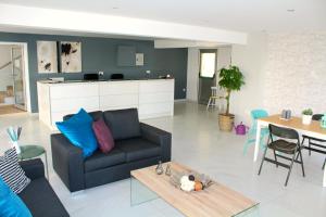 a living room with a couch and a table at Maria Zintili Apartments in Ayia Napa