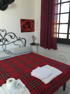 En eller flere senge i et værelse på Il Bastione Duca D'Aosta