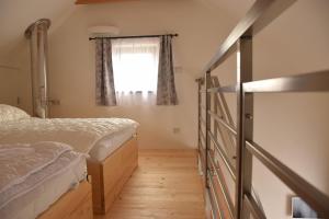 Postel nebo postele na pokoji v ubytování Apartmán Hejč