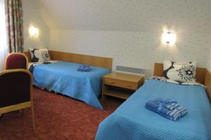 Katil atau katil-katil dalam bilik di Arina Holiday House