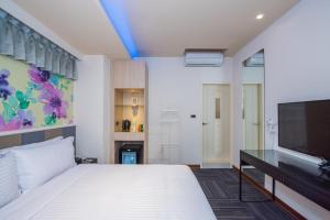 Postel nebo postele na pokoji v ubytování Macchi Hotel - Taipei