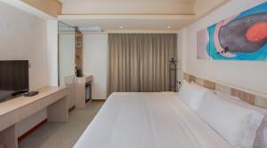 Postel nebo postele na pokoji v ubytování Macchi Hotel - Taipei