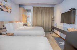 Postel nebo postele na pokoji v ubytování Macchi Hotel - Taipei