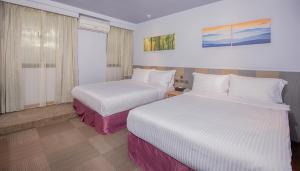 Postel nebo postele na pokoji v ubytování Macchi Hotel - Taipei