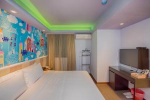 Postel nebo postele na pokoji v ubytování Macchi Hotel - Taipei