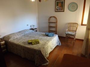 A bed or beds in a room at Cala Gonone Cozy House Sea View