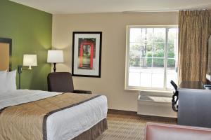 a hotel room with a bed and a window at Extended Stay America Suites - Minneapolis - Airport - Eagan - North in Eagan