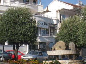 a statue of an elephant in front of a building at Apartments Circle Olive in Ulcinj