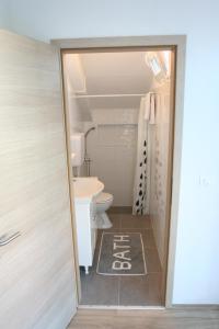 Kúpeľňa v ubytovaní Tiana Apartment + 11 fotografií