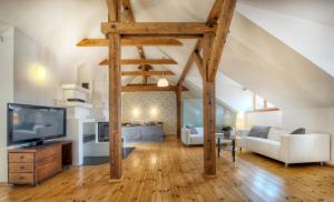 a large living room with wooden beams at Residence St Havel Prague Old Town in Prague +116 photos