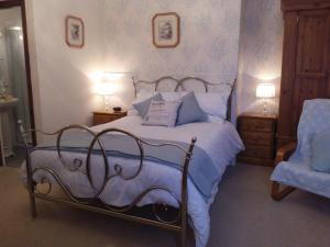 Postel nebo postele na pokoji v ubytování Boulmer Guest House