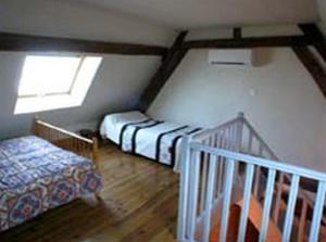 Postel nebo postele na pokoji v ubytování L'Ancien Presbytère + 8 fotografií