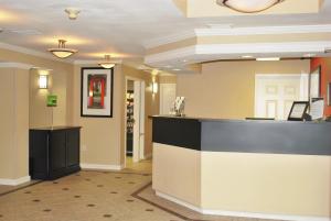 a lobby with a bar in the middle of a room at Extended Stay America Suites - St Louis - Westport - Central in Maryland Heights