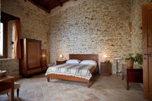 Postel nebo postele na pokoji v ubytování Residenza d'Epoca Borgodifiume