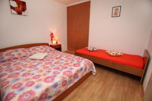 Postel nebo postele na pokoji v ubytování Apartment Miletic